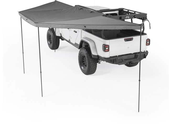 Smittybilt 180° Awning providing shade over a rugged vehicle for ultimate outdoor protection.