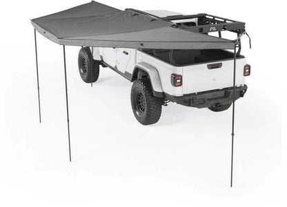 Smittybilt 180° Awning providing shade over a rugged vehicle for ultimate outdoor protection.