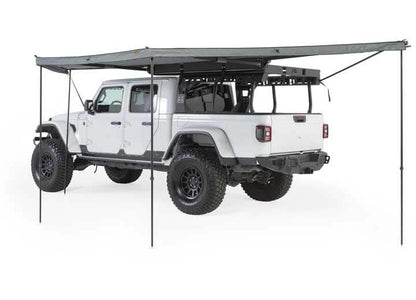 Smittybilt 180° Awning mounted on a vehicle, providing shade and outdoor protection.
