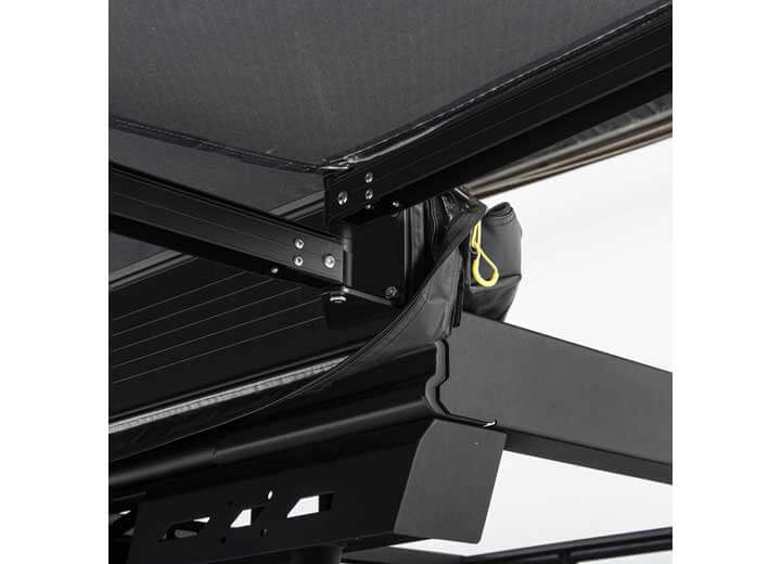 Close-up of Smittybilt 180° awning's heavy-duty materials and mounting system for robust support.